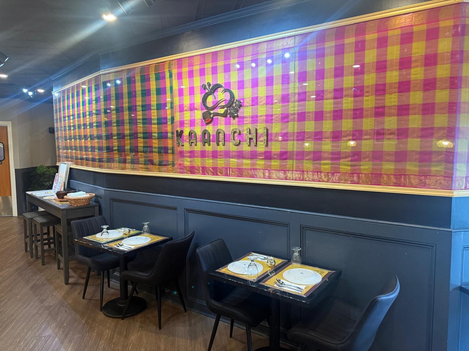 Kaanchi's Kanchipuram check-silk feature wall behind the dining room