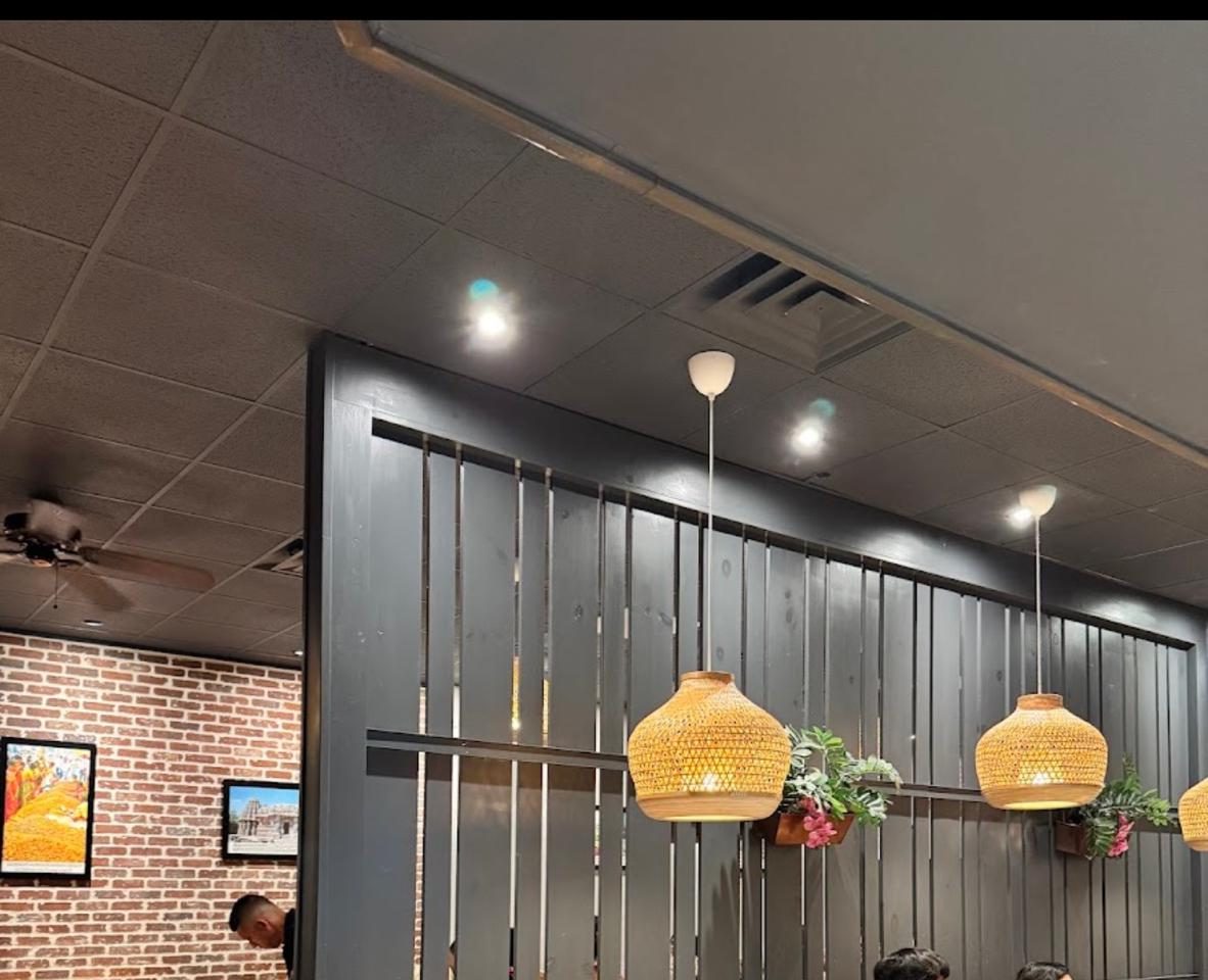 Malgudi's dining room, slat wall and pendant lighting