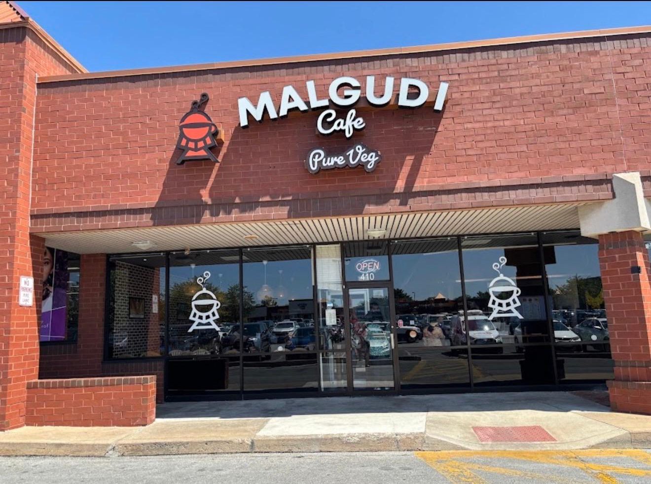Malgudi Cafe's storefront on a clear day