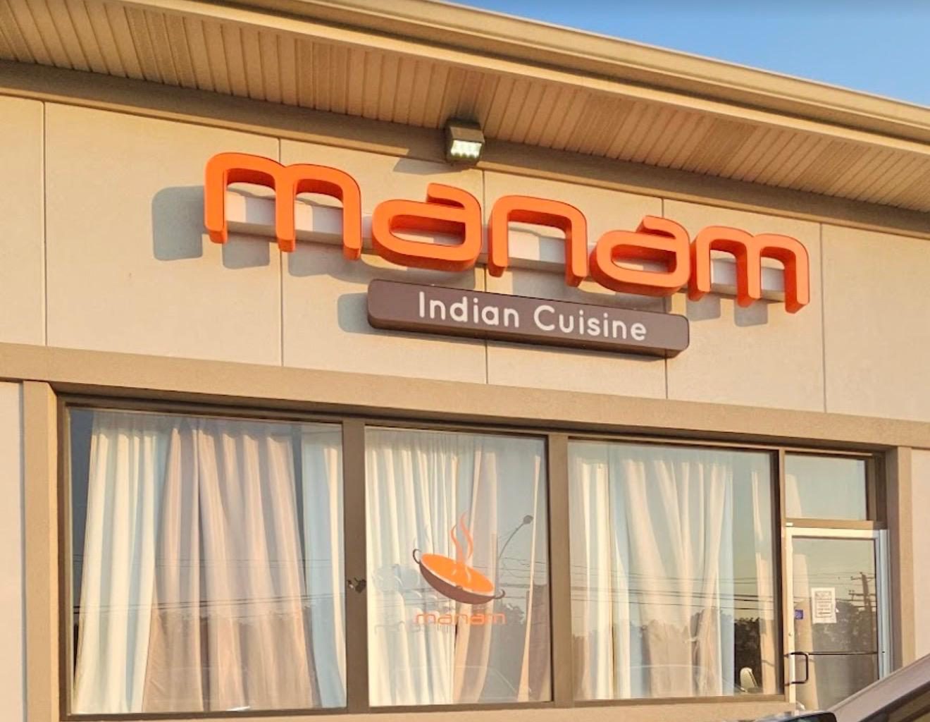 Manam Indian Cuisine storefront in daylight