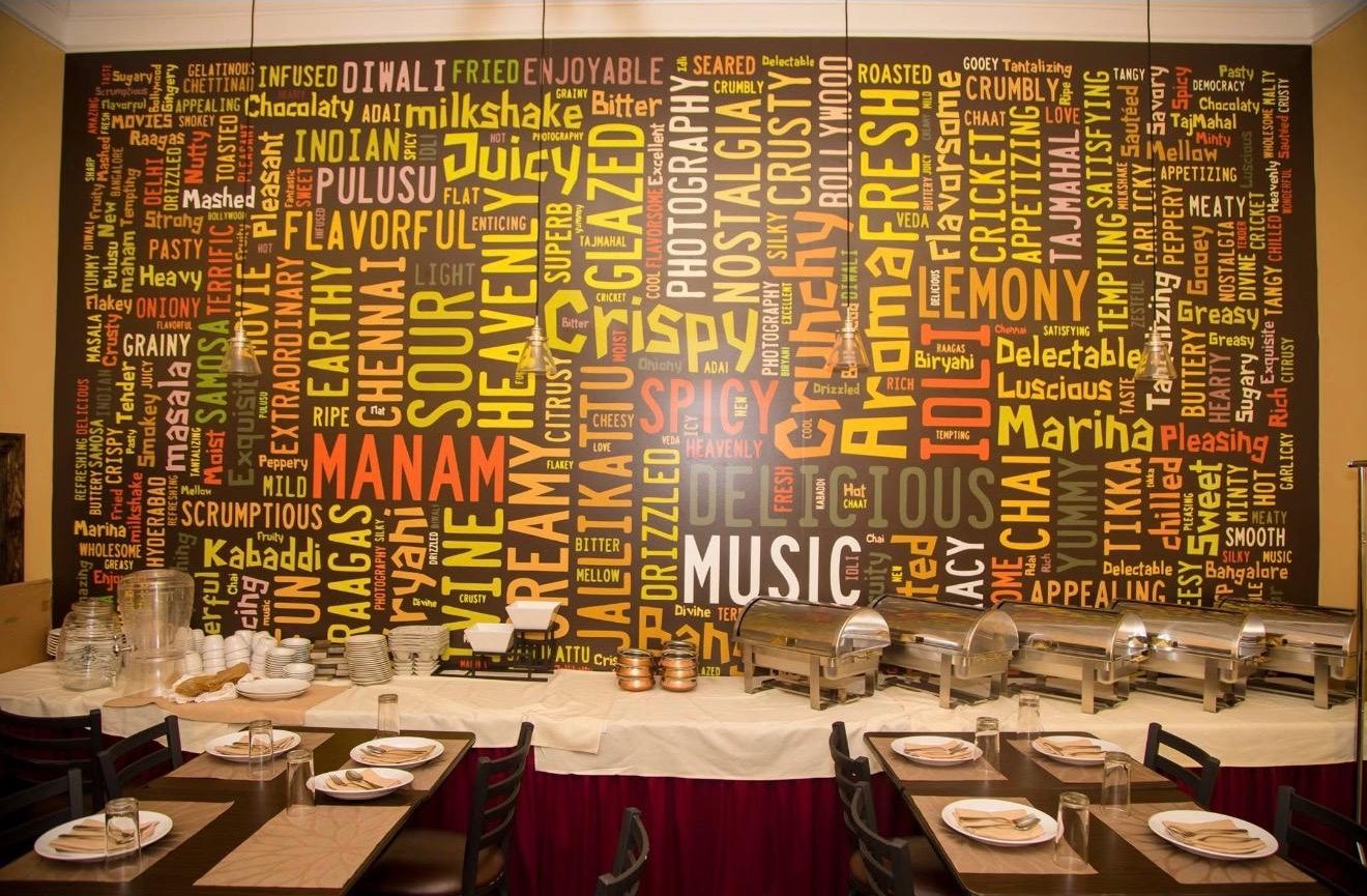 Manam's word-art feature wall behind the buffet